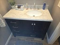 bathroom with vanity and baseboards