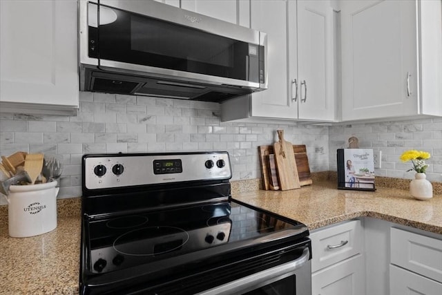 kitchen featuring white cabinetry and appliances with stainless steel finishes