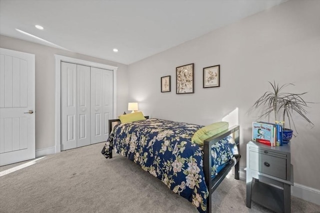 carpeted bedroom with a closet