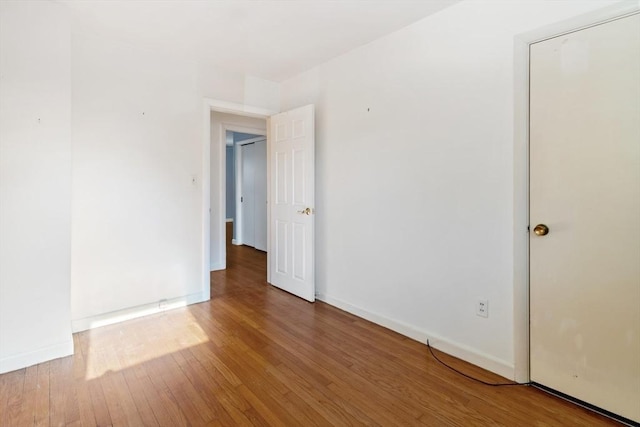 empty room featuring hardwood / wood-style floors