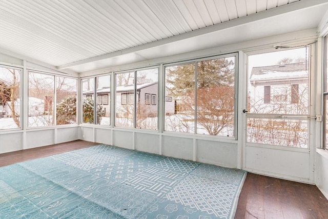 unfurnished sunroom with lofted ceiling