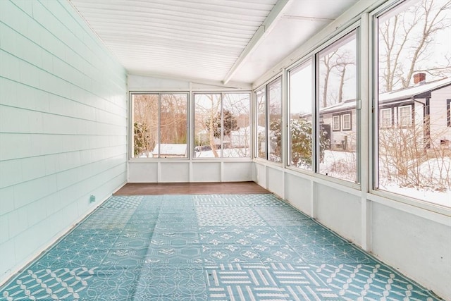 unfurnished sunroom with vaulted ceiling