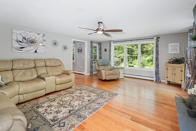 14 Daniels Rd, Charlton, MA 01507 - living room with baseboard heating, ceiling fan, and wood finished floors