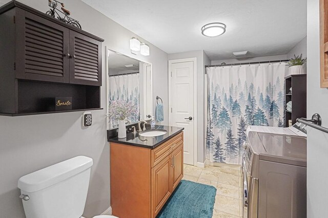 14 Daniels Rd, Charlton, MA 01507 - bathroom with vanity, toilet, independent washer and dryer, and curtained shower