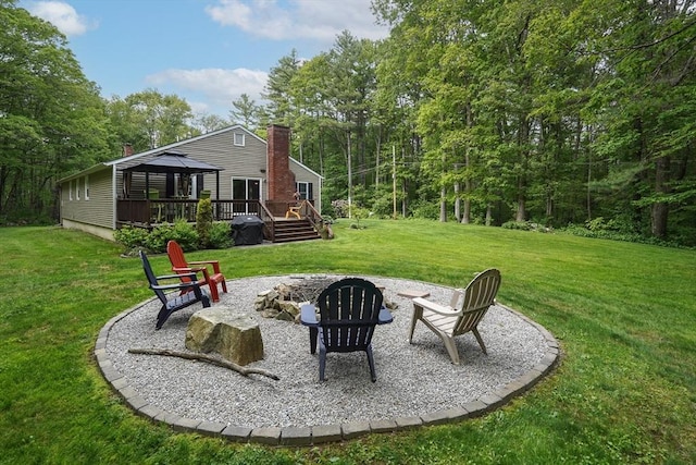 14 Daniels Rd, Charlton, MA 01507 - back of property featuring a fire pit, a deck, a gazebo, and a yard