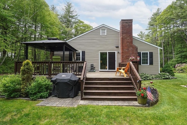 14 Daniels Rd, Charlton, MA 01507 - rear view of house featuring a gazebo, a lawn, a chimney, and a wooden deck