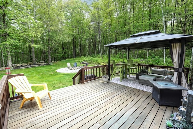 14 Daniels Rd, Charlton, MA 01507 - wooden terrace with a gazebo, a yard, a view of trees, and an outdoor living space with a fire pit