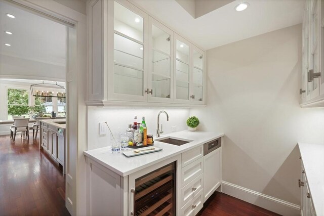 210 Monument Farm Rd, Concord, MA 01742 - bar featuring wine cooler, recessed lighting, baseboards, dark wood finished floors, and a sink