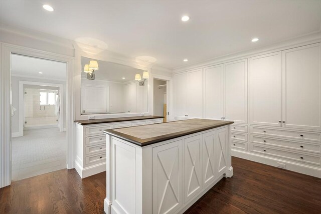 210 Monument Farm Rd, Concord, MA 01742 - kitchen featuring a center island, white cabinetry, and dark wood-type flooring