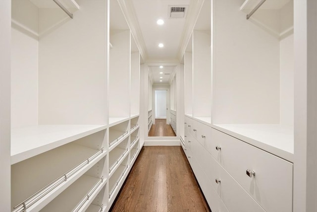 210 Monument Farm Rd, Concord, MA 01742 - spacious closet featuring dark wood-style floors and visible vents