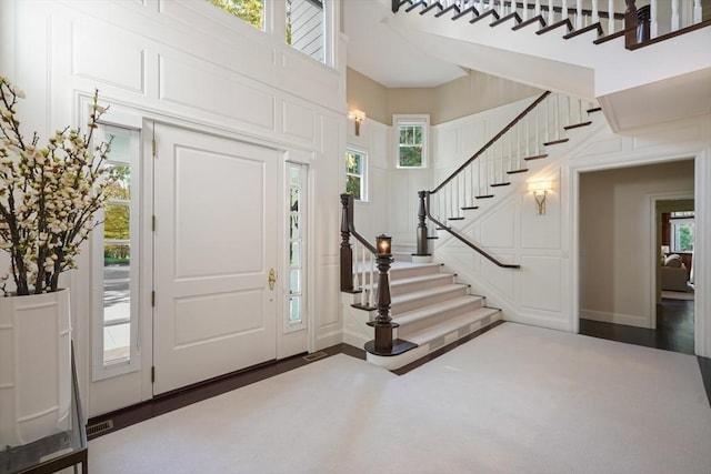 210 Monument Farm Rd, Concord, MA 01742 - entrance foyer with baseboards, a high ceiling, and stairs
