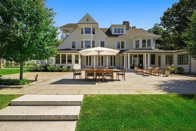 210 Monument Farm Rd, Concord, MA 01742 - rear view of property featuring a yard, a patio, and a chimney