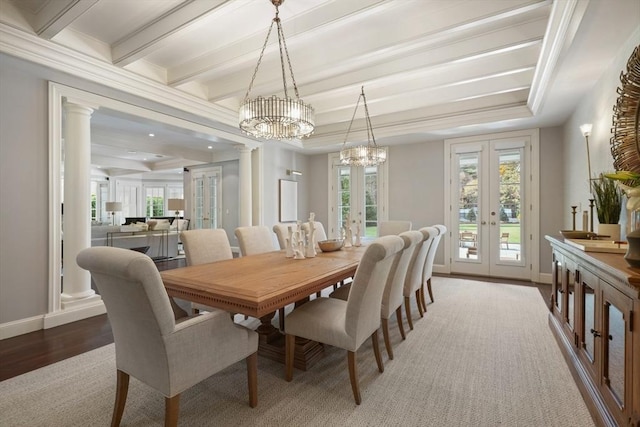 210 Monument Farm Rd, Concord, MA 01742 - dining room with wood finished floors, french doors, baseboards, and a notable chandelier
