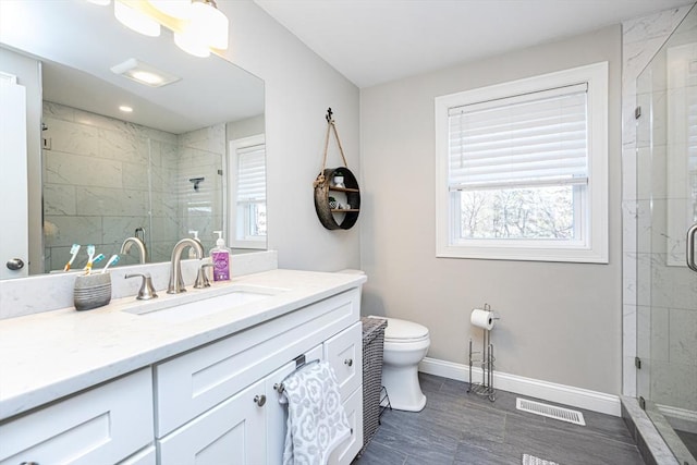 full bathroom with visible vents, a shower stall, baseboards, toilet, and vanity