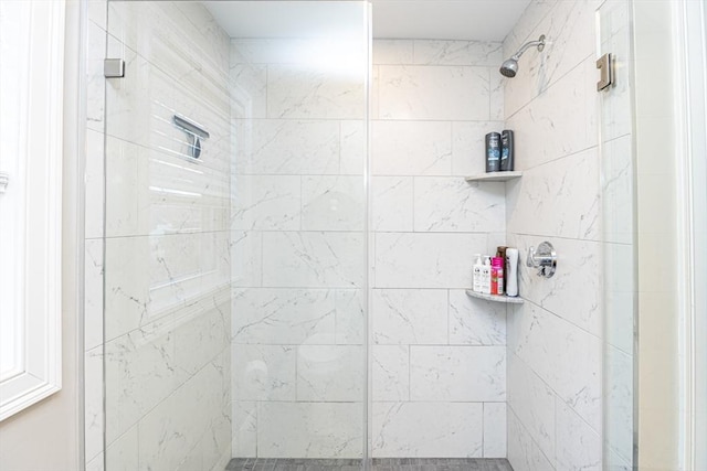 bathroom with a shower stall