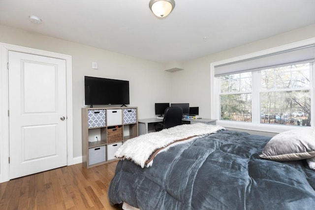 bedroom featuring wood finished floors