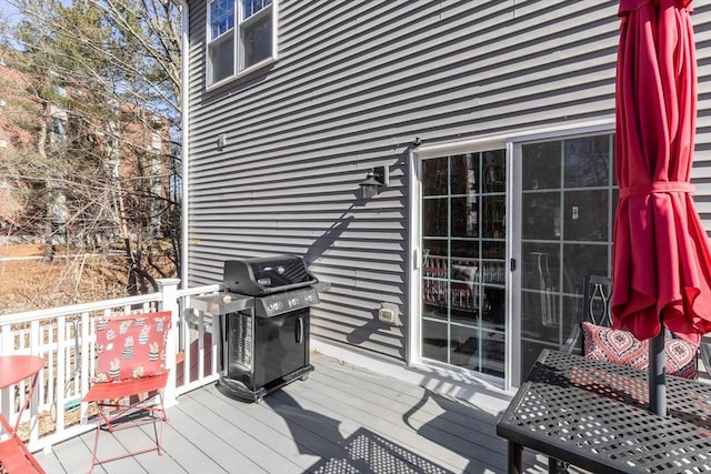 wooden deck featuring grilling area