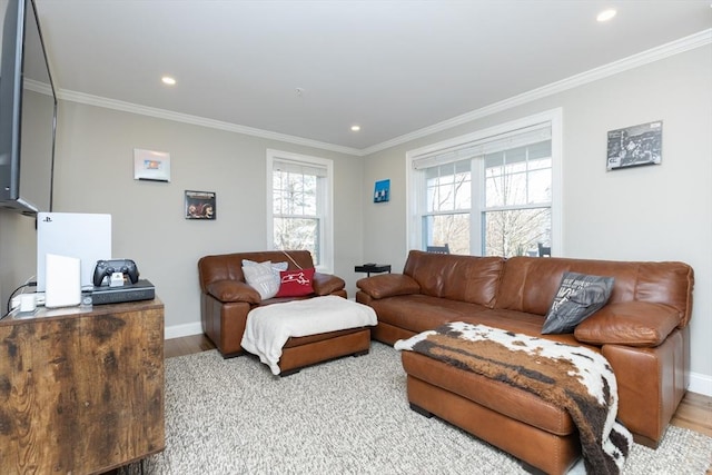 living area featuring light wood-style flooring and ornamental molding