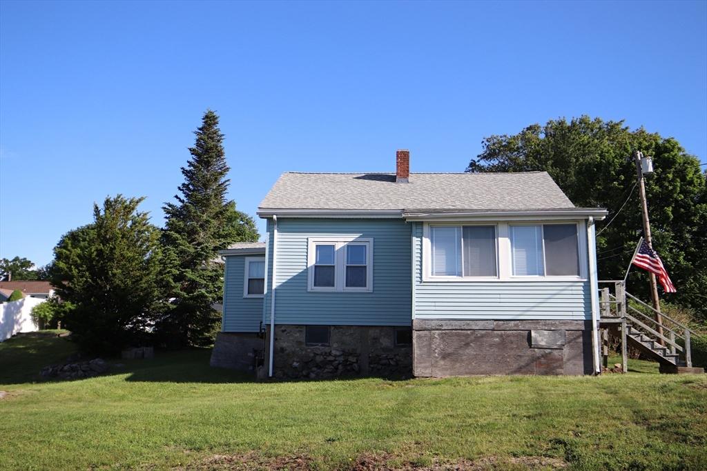 23 Bay View Rd, Saugus, MA 01906 - view of home's exterior with stairway, a yard, and a chimney