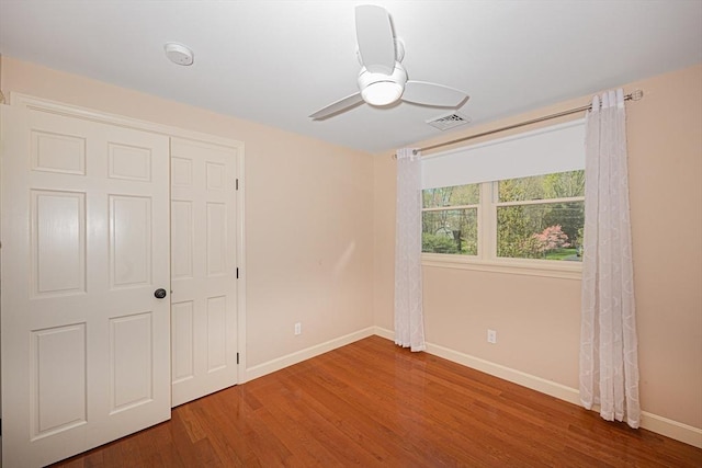 27 Ann St, Raynham, MA 02767 - unfurnished bedroom featuring wood finished floors, a ceiling fan, and a closet