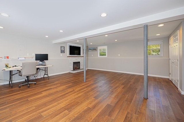 27 Ann St, Raynham, MA 02767 - home office featuring healthy amount of natural light, wood finished floors, a stone fireplace, and recessed lighting