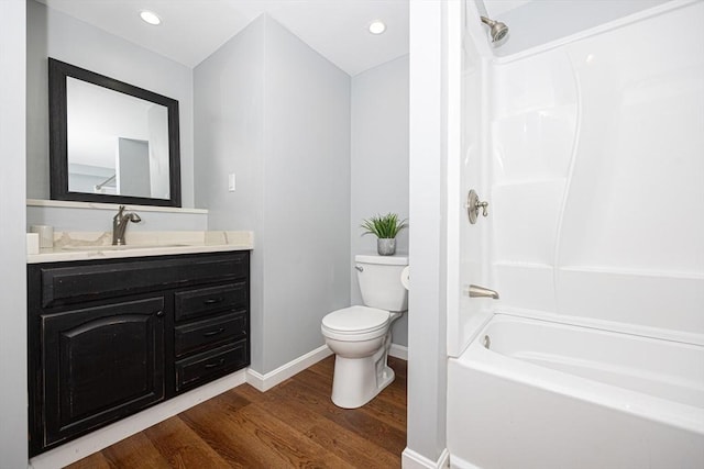 27 Ann St, Raynham, MA 02767 - full bathroom with wood finished floors, vanity, shower / bath combination, and recessed lighting