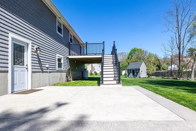 27 Ann St, Raynham, MA 02767 - view of patio with stairway, a storage shed, and a deck