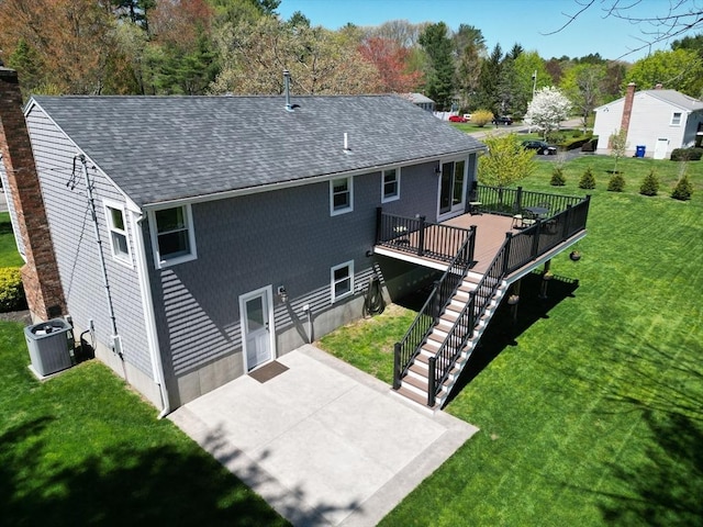 27 Ann St, Raynham, MA 02767 - back of house with roof with shingles, a patio, a lawn, a deck, and stairs