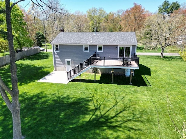 27 Ann St, Raynham, MA 02767 - rear view of house with a wooden deck, stairway, a chimney, and roof with shingles