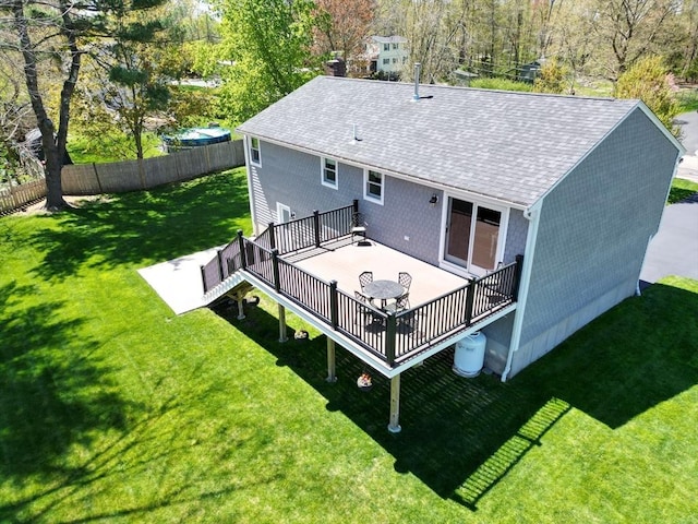 27 Ann St, Raynham, MA 02767 - rear view of house featuring a shingled roof, a wooden deck, and a chimney