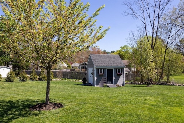 27 Ann St, Raynham, MA 02767 - view of front facade with an outbuilding and a shingled roof