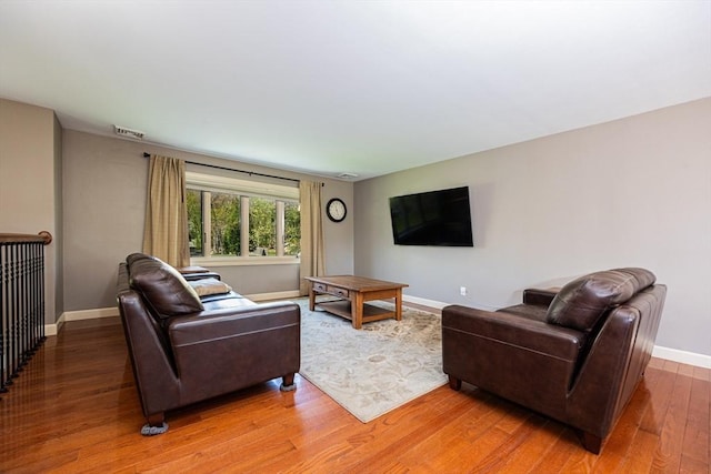 27 Ann St, Raynham, MA 02767 - living area featuring light wood-type flooring and baseboards