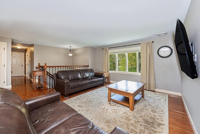 27 Ann St, Raynham, MA 02767 - living room with wood finished floors and attic access