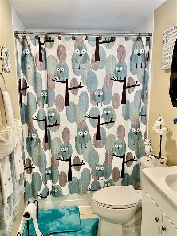 67 Oakcrest Rd, Boston, MA 02136 - full bath featuring vanity and shower / tub combo with curtain