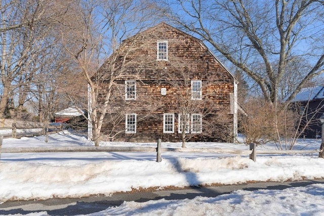 view of front of home featuring a barn and a gambrel roof