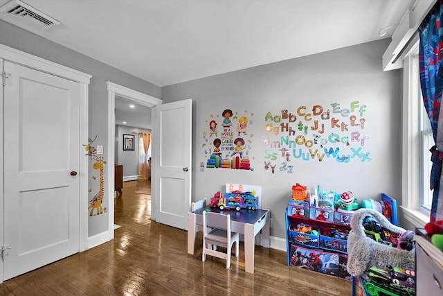 313 Walter St, Fall River, MA 02724 - rec room featuring wood finished floors, plenty of natural light, and a baseboard radiator