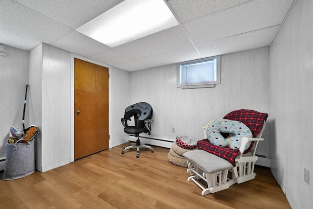 313 Walter St, Fall River, MA 02724 - living area with baseboard heating, wood finished floors, and a drop ceiling