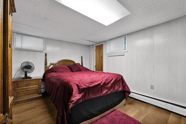 313 Walter St, Fall River, MA 02724 - bedroom featuring a drop ceiling, wood finished floors, and baseboard heating