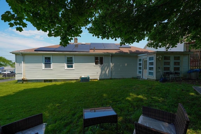 313 Walter St, Fall River, MA 02724 - back of house featuring roof mounted solar panels and a yard