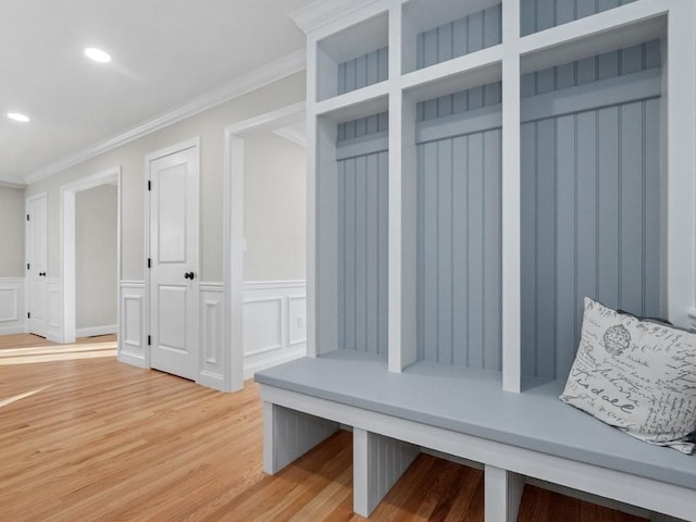 mudroom featuring ornamental molding and hardwood / wood-style flooring