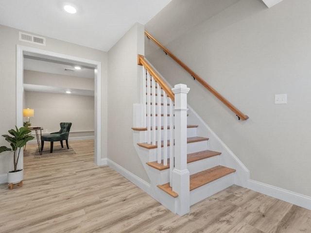 staircase featuring hardwood / wood-style floors