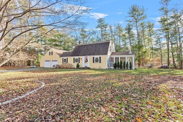 colonial inspired home with a gambrel roof, a chimney, and fence