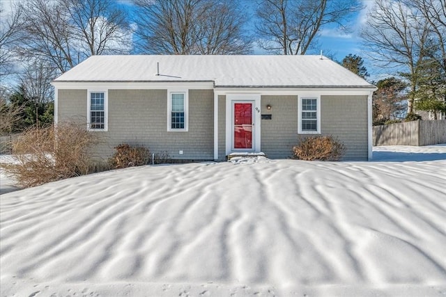 single story home featuring fence