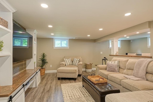 7 Luan Cir, Chelmsford, MA 01824 - living room featuring recessed lighting, light wood-style flooring, baseboards, and ornate columns