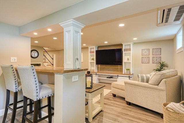 7 Luan Cir, Chelmsford, MA 01824 - living room featuring stairway, light wood-style flooring, recessed lighting, and decorative columns