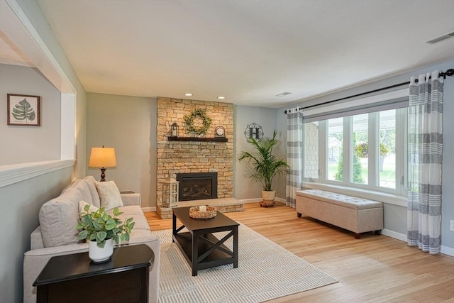 7 Luan Cir, Chelmsford, MA 01824 - living room with light wood-type flooring, baseboards, a fireplace, and recessed lighting