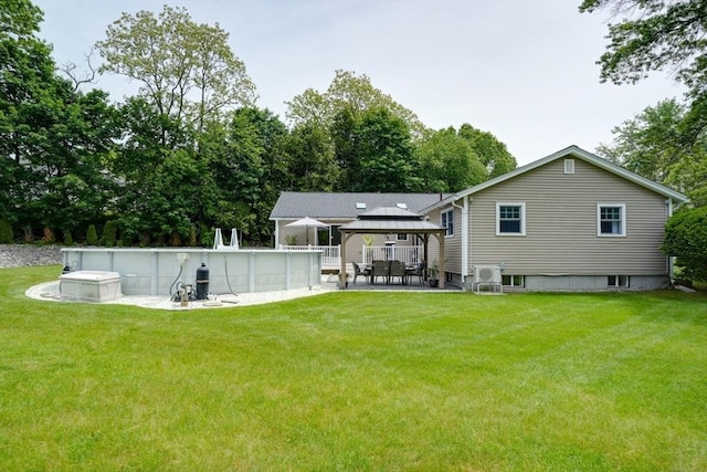 7 Luan Cir, Chelmsford, MA 01824 - rear view of house with a gazebo, an outdoor pool, and a yard