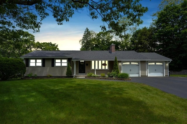 7 Luan Cir, Chelmsford, MA 01824 - ranch-style house with a garage, driveway, a front yard, and a chimney