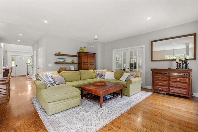 23 Crimson Dr, Shrewsbury, MA 01545 - living room with light wood-style flooring, recessed lighting, baseboards, and french doors