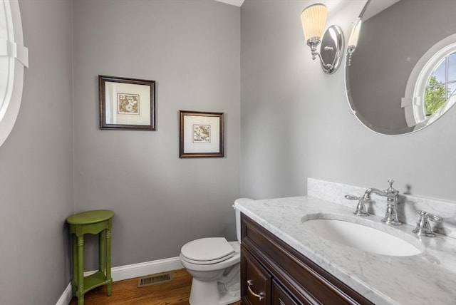 23 Crimson Dr, Shrewsbury, MA 01545 - bathroom with vanity, baseboards, toilet, and wood finished floors